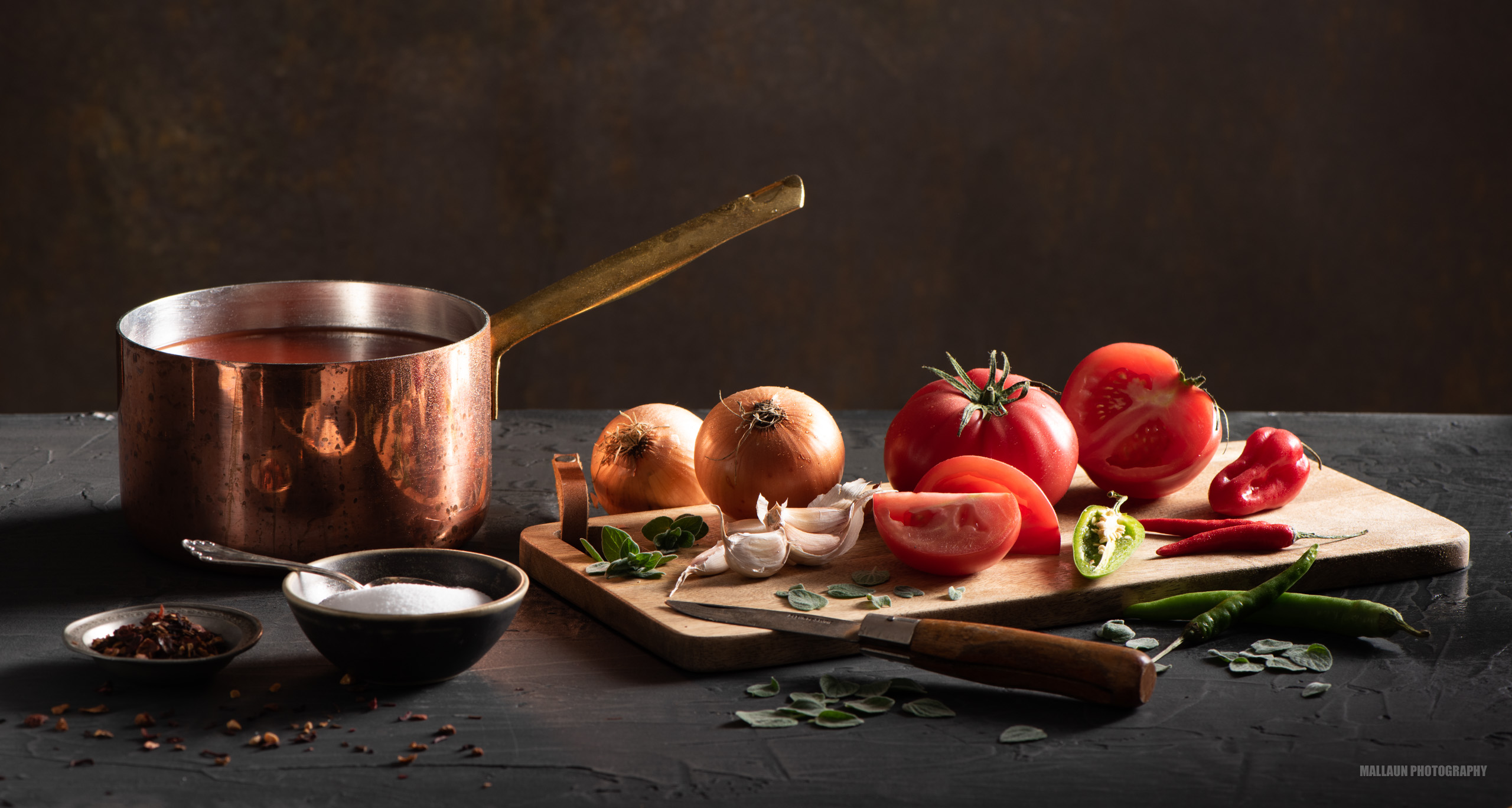 Tomato soup with tomatoes garlic onions and chili - dark food photography